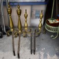 D03. Brass andirons. 